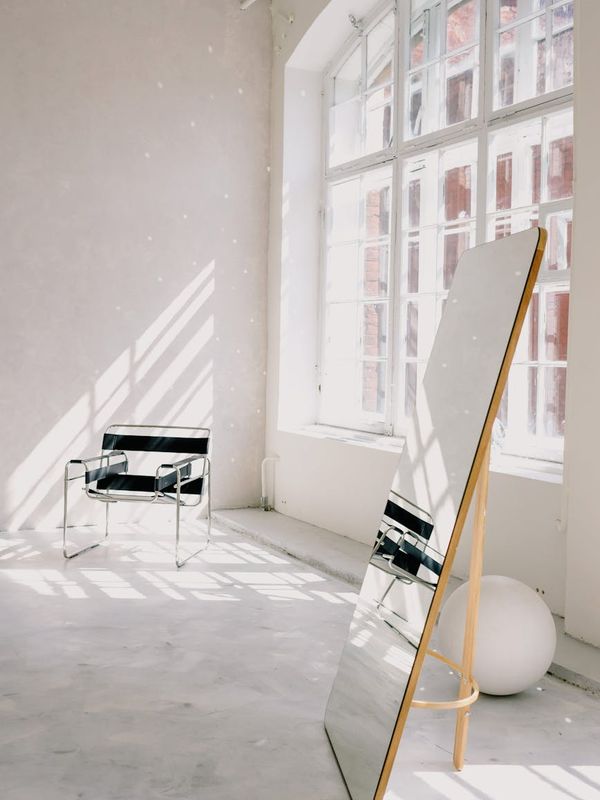 Bright, open room with minimalist decor suitable for home workouts.